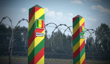 Border posts with flags of Senegal and Guinea Bissau - 3d illustrationの写真素材