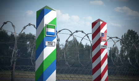 Border posts with flags of Sierra Leone and Liberia - 3d illustrationの写真素材
