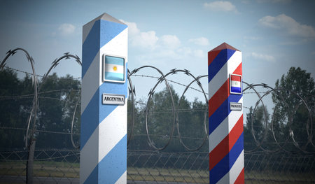 Border posts with flags of Argentina and Paraguay - 3d illustrationの写真素材