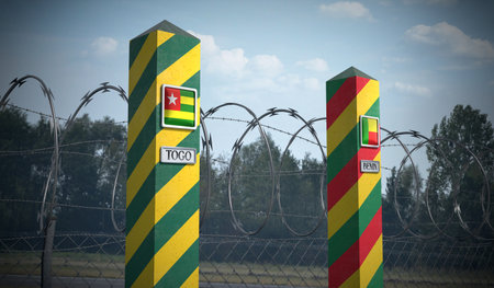 Border posts with flags of Togo and Benin - 3d illustrationの写真素材