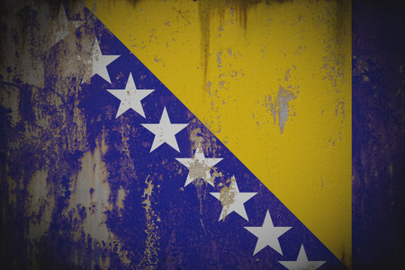 Bosnia and Herzegovina - Weathered Flag on Old Wall with Peeling Paint and Rustの写真素材
