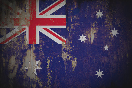Australia - Weathered Flag on Old Wall with Peeling Paint and Rustの写真素材