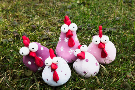 Group of handmade spring easter chicken made of polymer clay. Funny creative sculptures decoration.