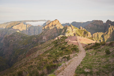 Footpath from Pico do Arieiro to Pico Ruivo mountain peak in Madeira island, Portugal. Beautiful morning landscape shot.の写真素材