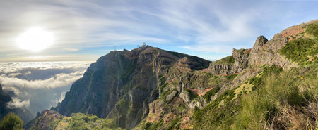 Panoramic landscape view to Pico do Arieiro mountain peak with radar ball antenna tower station in Madeira island, Portugal. Beautiful morning landscape shot.の写真素材