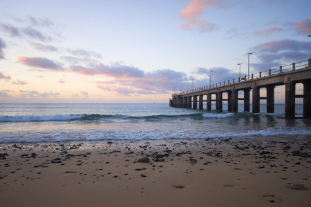 Pier in Porto Santo isle in the morning with colorful clouds. Porto Santo is an island near Madeira, Portugal.の写真素材