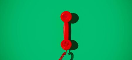 Minimal composition for communication concept. Red vintage handset on green background. 3d rendering illustration.の写真素材