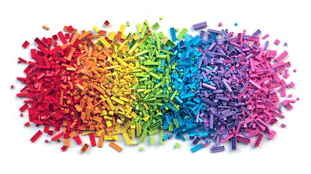 Pile of colorful rainbow toy bricks isolated on white background. Educational toy for children. 3d...