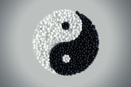 Black and white glass marbles forming Yin yang symbol on light grey background の写真素材