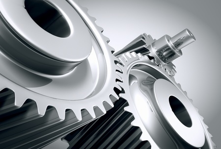 Close up of a group of interlocking stainless steel gears.の写真素材