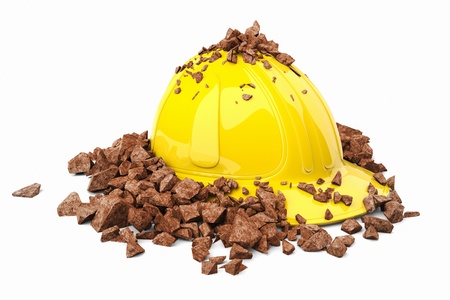 Brick smashed on a yellow safety helmet.の写真素材