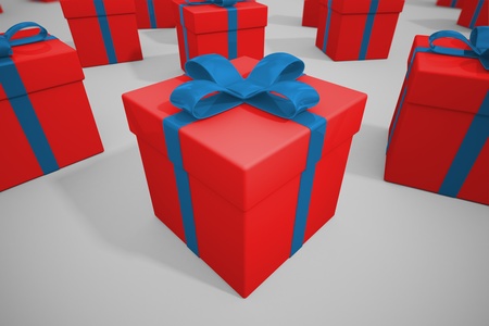 Yellow boxes of presents with blue ribbons on a dark gray background. Upper view. Perfect for birthday, anniversay or Christmas.の写真素材