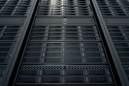 Shot from the top of data servers while working with yellow LED lights flashing. Image can represent cloud computing, information storage, etc. or can be the perfect technology background. の写真素材