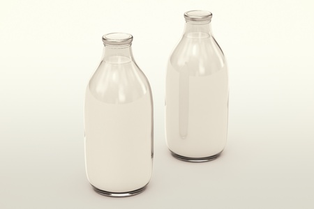Two isolated glass milk bottles on a white background. Perfect for any health or natural nutricion realted purposes.の写真素材