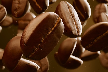 Brown roasted coffee beans falling. Dark background. May represent breakfast, energy, freshness or great aroma.の写真素材