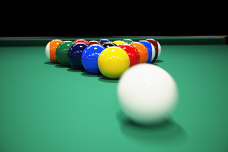Billiard balls on the green baize of a billiard table. Breaking the rack in pool.Strong shot of cue...