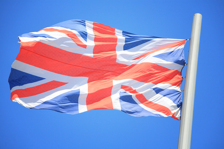 The British flag against the background of the blue skyの写真素材