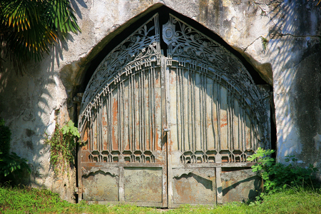 Old rusty gate in the abandoned houseの写真素材