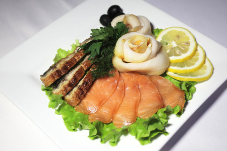 Variety of fish and meat slices in plateの写真素材