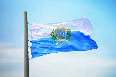 Flag of San Marino against the background of the skyの写真素材