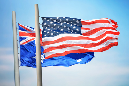 Flags of the USA and Australia against the background of the blue skyの写真素材
