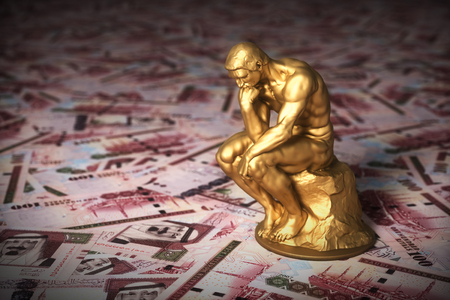 Gold Sculpture Thinker Over Money Saudi Riyalsの写真素材