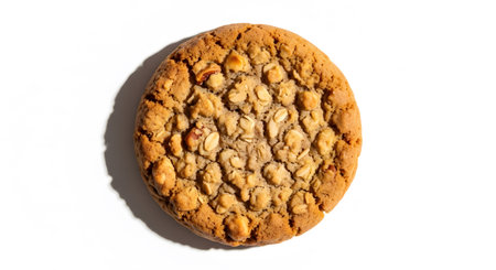 A macro shot of a peanut butter cookie on a white background.の素材