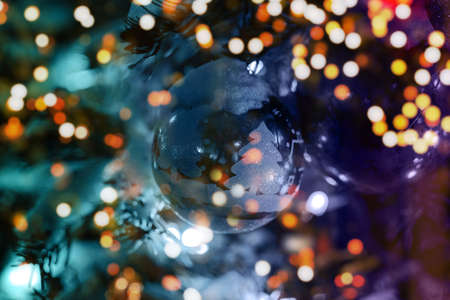 christmas tree branch with christmas balls and lightsの写真素材