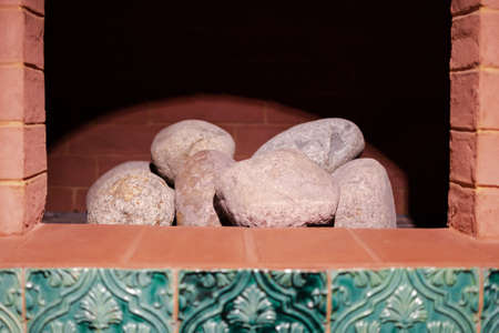 a brick oven with stones inside, without fireの写真素材