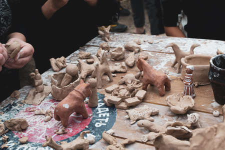 Moscow, Russia - September 5, 2020. Children sculpt clay figurines in the open air. Art, creativity....