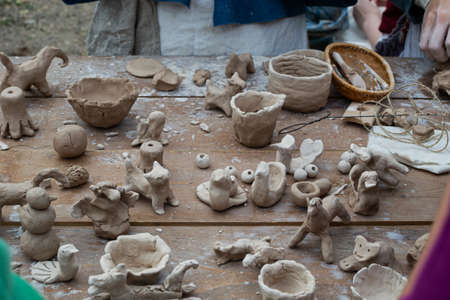 Moscow, Russia - September 5, 2020. Children sculpt clay figurines in the open air. Art, creativity. Modeling clay, cultural traditions, hobbyのeditorial素材