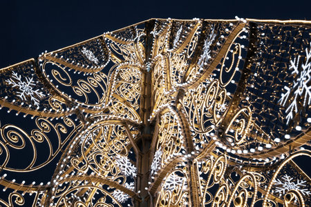 Moscow, Russia - November 29, 2020: Beautiful openwork christmas tree close up in VDNKH park,...