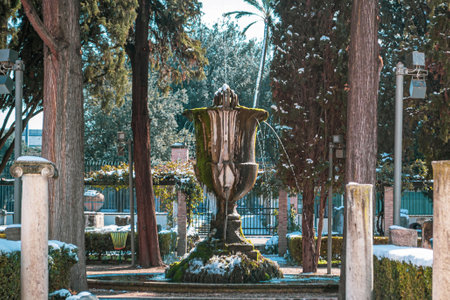 Rome, Italy - February 26, 2018: Fountain in the National Museum of Rome, Baths of Diocletian under snow. Abnormal snow falls in Romeのeditorial素材