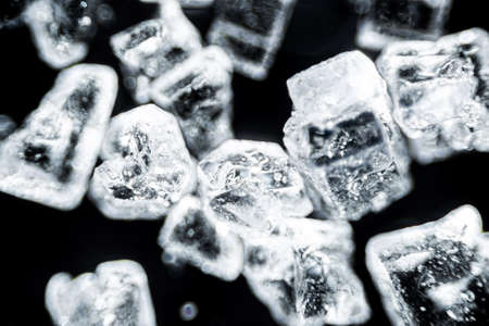 Crystal sugar close up on black background under the light microscope with a magnification of 40 timesの写真素材