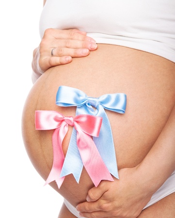 Beautiful young pregnant woman with ribbons, isolated, available in different colours の写真素材