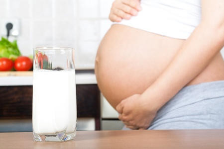 Healthy pregnancy  Pregnant woman with glass of milkの写真素材
