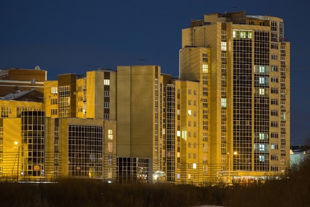 multi-storey building on the waterfront at night