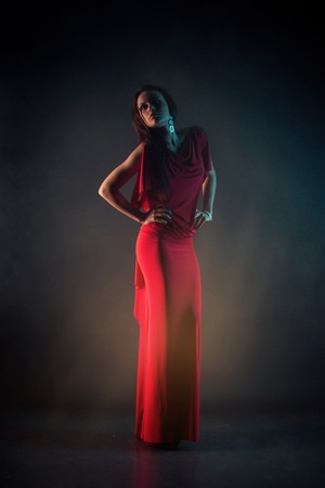 Sexy young beauty woman in red dressの写真素材