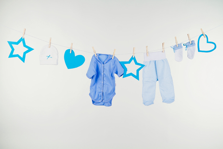 Colorful child boy clothes set isolated on white. Collage of male kid clothing on white background.の写真素材