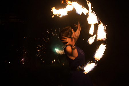Beautiful young girl showing a fire showの写真素材