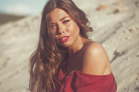 Young beautiful girl on a sandy beachの写真素材