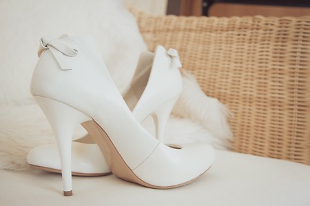 Couple Wedding rings on cup cake. Wedding symbols, attributes. Holiday, celebration. with blur couple heart and flowersの写真素材