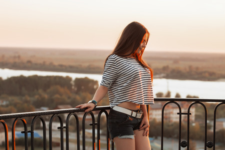 Young beautiful girl on a sandy beachの写真素材