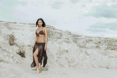Young beautiful girl on a sandy beachの写真素材