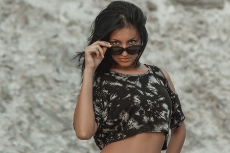 Young beautiful girl on a sandy beach