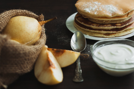 Pancake with fruits and berries on plate on table close up.の写真素材