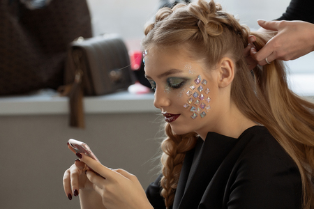 Weave braid girl in a hair salon.の写真素材