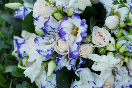 Beautiful wedding bouquet and rings.の写真素材