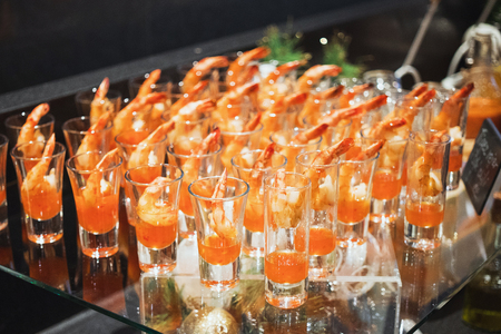 Shrimp cocktail in shot glass shot closeup.の写真素材