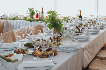 Wedding candy bar decoration setup with delicious cakes and sweets.の写真素材